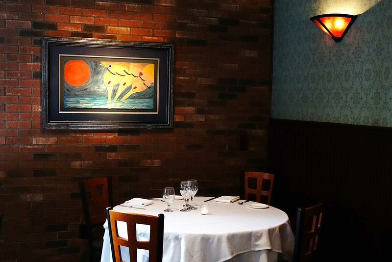 Round set table for four in dining room