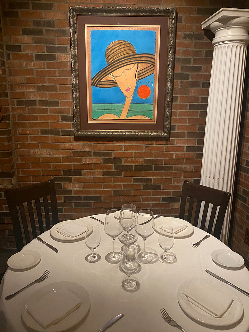 Round table set for 4 guests in dining room