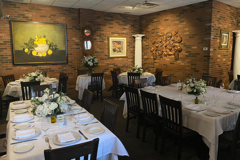 Dining room set with white flowers and table cloths